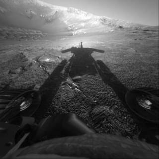 The dramatic image of NASA's Mars Exploration Rover Opportunity's shadow was taken on sol 180 (July 26, 2004) by the rover's front hazard-avoidance camera as the rover moved farther into Endurance Crater in the Meridiani Planum region of Mars.<br /><br />Credits: NASA/JPL-Caltech