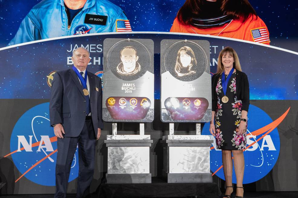 Former NASA astronauts Jim Buchli and Janet Kavandi are inducted into the U.S. Astronaut Hall of Fame Class of 2019 during a ceremony on April 6, 2019, inside the Space Shuttle Atlantis attraction at NASA’s Kennedy Space Center Visitor Complex in Florida. They unveiled their plaques, which will be placed in the Hall of Fame at the visitor complex.<br />Credits: NASA/Cory Huston