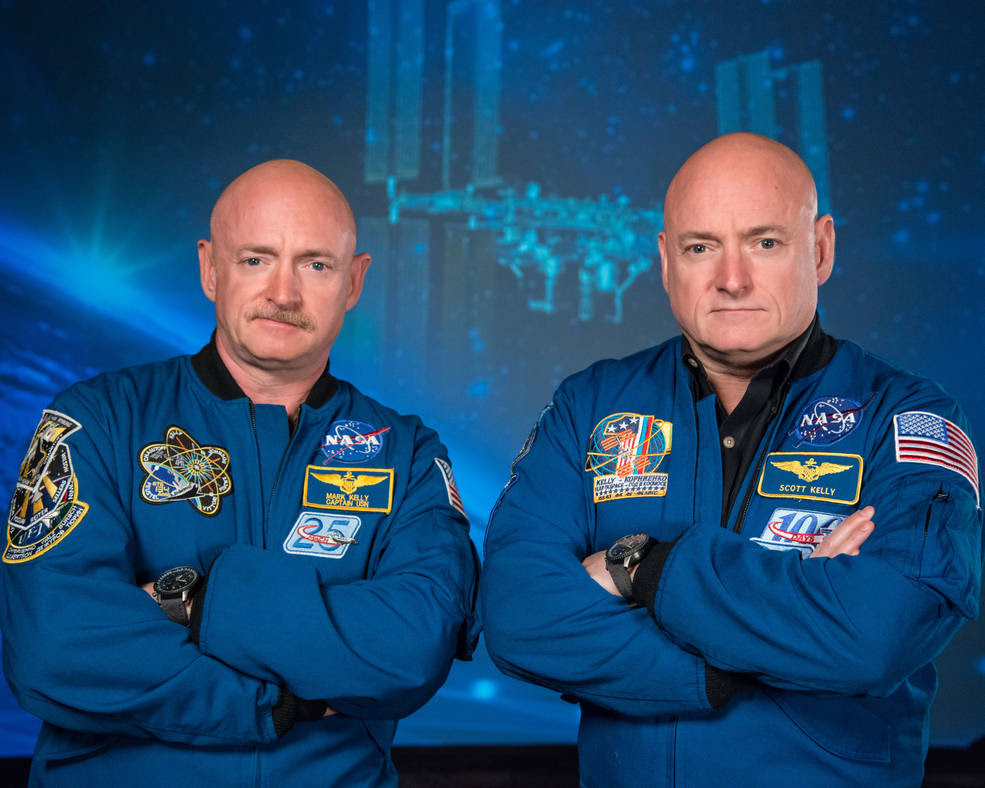 Former astronaut Scott Kelly (right), who was the Expedition 45/46 commander during his one-year mission aboard the International Space Station, along with his twin brother, former astronaut Mark Kelly (left).<br />Credits: NASA/ Robert Markowitz