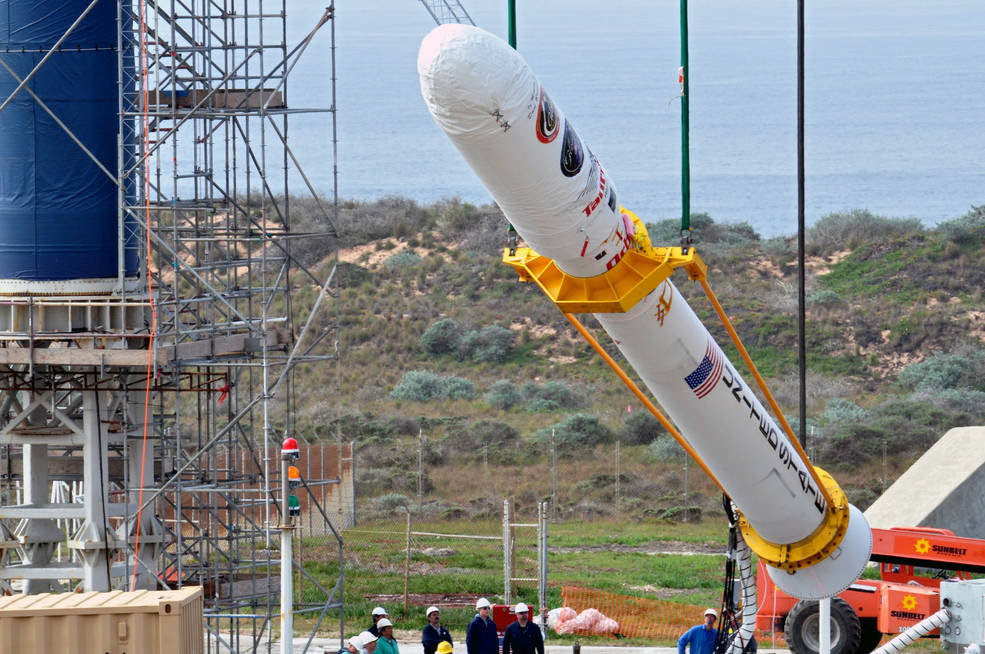 On Space Launch Complex 576-E at Vandenberg Air Force Base in California, Orbital Sciences workers monitor NASA's Glory upper stack as a crane lifts it from a stationary rail for attachment to the Taurus XL rocket's Stage 0.<br />Credits: NASA