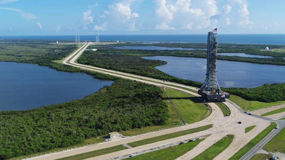 This aerial view shows NASA's mobile launcher atop crawler-transporter 2 as it moves along the crawlerway, making its way to Launch Pad 39B at the agency's Kennedy Space Center in Florida.<br />Credits: NASA