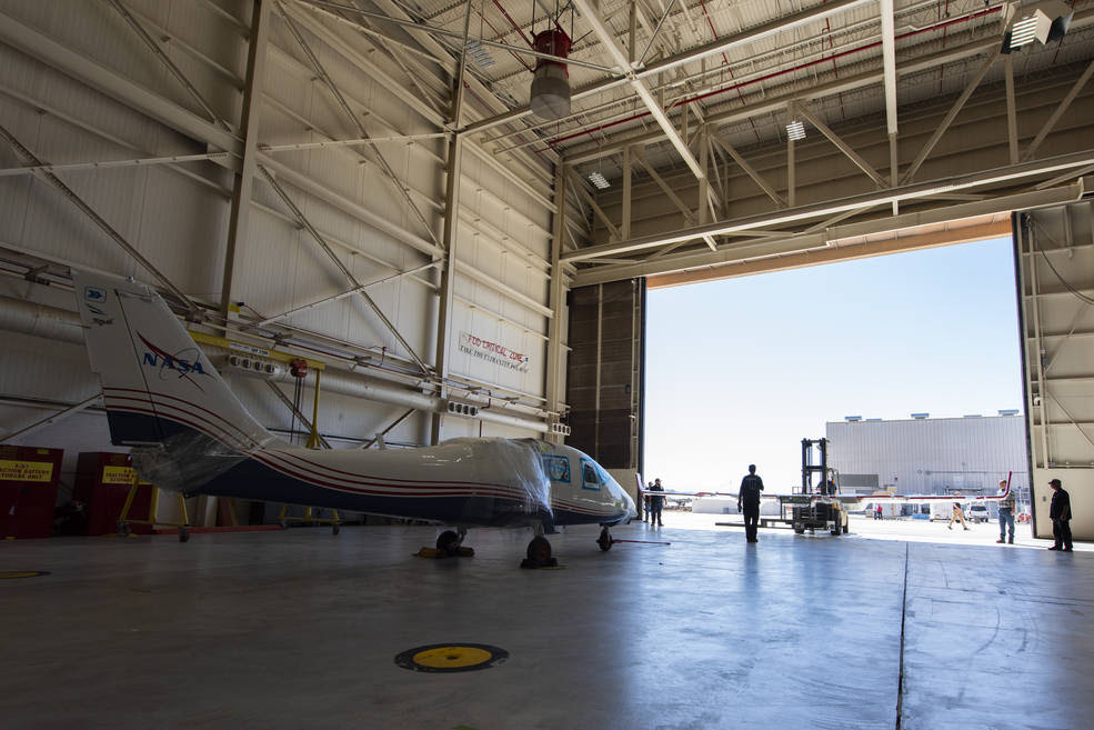 NASA’s X-57 Maxwell, the agency’s first all-electric X-plane and first crewed X-planed in two decades, is delivered to NASA’s Armstrong Flight Research Center in Edwards, California, in its Mod II configuration. The first of three primary modifications for the project, Mod II involves testing of the aircraft’s cruise electric propulsion system. Delivery to NASA from prime contractor Empirical Systems Aerospace of San Luis Obispo, California, marks a major milestone for the project, at which point the vehicle is reintegrated for ground tests, to be followed by taxi tests, and eventually, flight tests. X-57’s goal is to further advance the design and airworthiness process for distributed electric propulsion technology for general aviation aircraft, which can provide multiple benefits to efficiency, emissions, and noise.<br />Credits: NASA