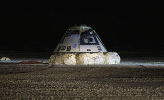 The Boeing CST-100 Starliner spacecraft is seen after it landed in White Sands, New Mexico, Sunday, Dec. 22, 2019. The landing completes an abbreviated Orbital Flight Test for the company that still meets several mission objectives for NASA’s Commercial Crew program. The Starliner spacecraft launched on a United Launch Alliance Atlas V rocket at 6:36 a.m. Friday, Dec. 20 from Space Launch Complex 41 at Cape Canaveral Air Force Station in Florida.<br /><br />Credits: NASA/Bill Ingalls