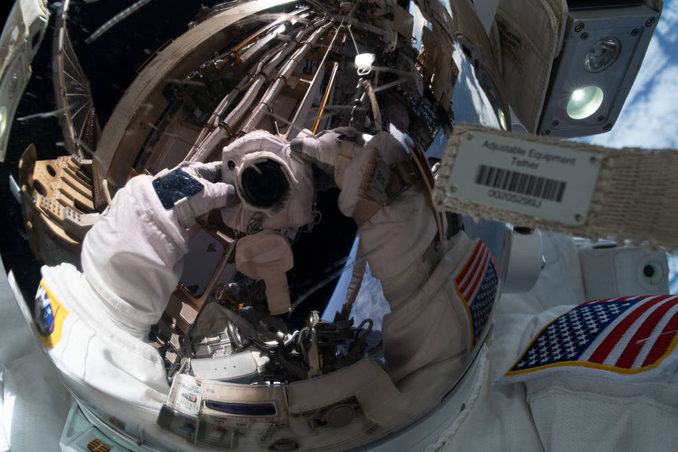 NASA astronaut Jessica Meir takes an out-of-this-world &quot;space-selfie&quot; with her spacesuit helmet visor down reflecting her camera and International Space Station hardware. She and fellow NASA astronaut Christina Koch (out of frame) ventured into the vacuum of space for seven hours and 17 minutes to swap a failed battery charge-discharge unit (BCDU) with a spare during the first all-woman spacewalk.<br />Credits: NASA