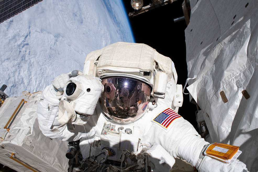NASA astronaut Andrew Morgan prepares to take a photograph while conducting a spacewalk outside the International Space Station Nov. 22, 2019.<br />Credits: NASA