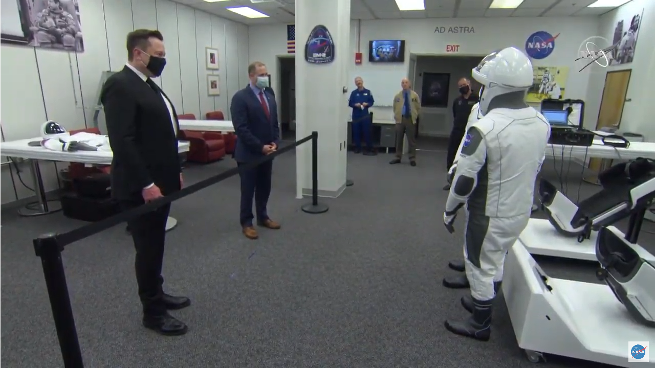 Elon Musk and Jum Bridenstine in suit up room.png