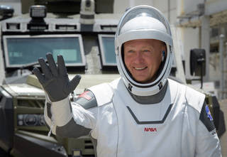 NASA astronaut Douglas Hurley waves as he and fellow crew member Robert Behnken depart the Neil A. Armstrong Operations and Checkout Building for Launch Complex 39A to board the SpaceX Crew Dragon spacecraft for the Demo-2 mission launch, Saturday, May 30, 2020, at NASA’s Kennedy Space Center in Florida. NASA’s SpaceX Demo-2 mission is the first launch with astronauts of the SpaceX Crew Dragon spacecraft and Falcon 9 rocket to the International Space Station as part of the agency’s Commercial Crew Program. The test flight serves as an end-to-end demonstration of SpaceX’s crew transportation system. Behnken and Hurley are scheduled to launch at 3:22 p.m. EDT on Saturday, May 30, from Launch Complex 39A at the Kennedy Space Center. A new era of human spaceflight is set to begin as American astronauts once again launch on an American rocket from American soil to low-Earth orbit for the first time since the conclusion of the Space Shuttle Program in 2011.<br /><br />Credits: NASA/Bill Ingalls