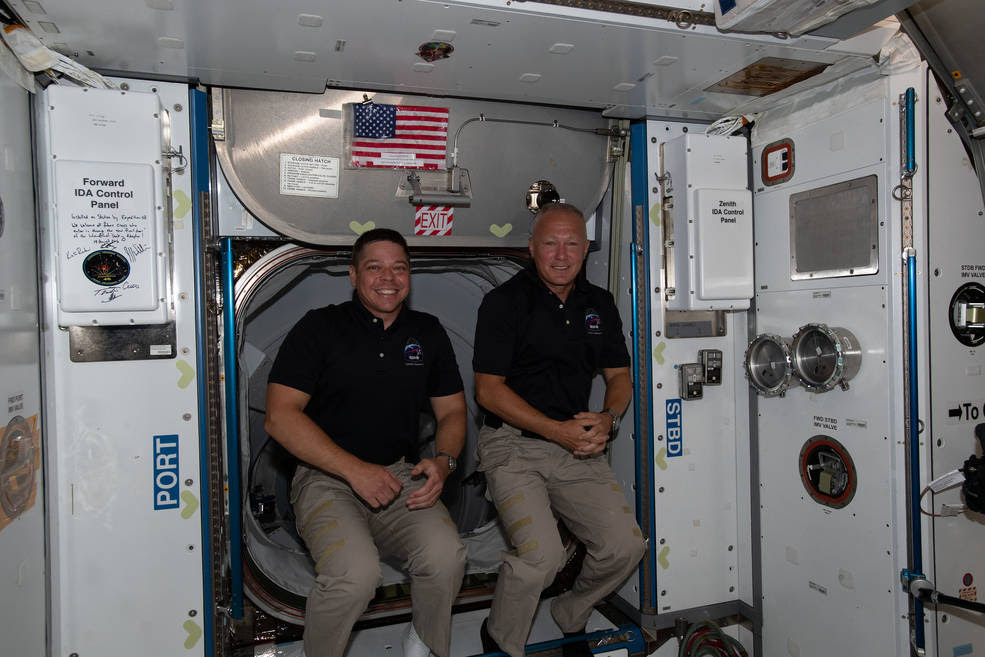 The International Space Station's two newest crew members, NASA astronauts Bob Behnken, left, and Doug Hurley<br />The International Space Station's two newest crew members, NASA astronauts Bob Behnken, left, and Doug Hurley, are pictured having just entered the orbiting lab shortly after arriving aboard the SpaceX Crew Dragon spacecraft.<br />Credits: NASA