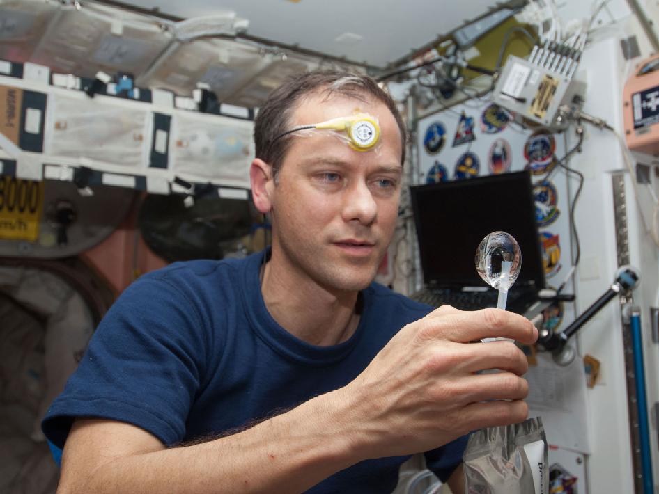ISS034-E-031709 (21 Jan. 2013) --- NASA astronaut Tom Marshburn, Expedition 34 flight engineer, squeezes a water bubble out of his beverage container in the Unity node of the International Space Station.<br />credit: NASA.gov