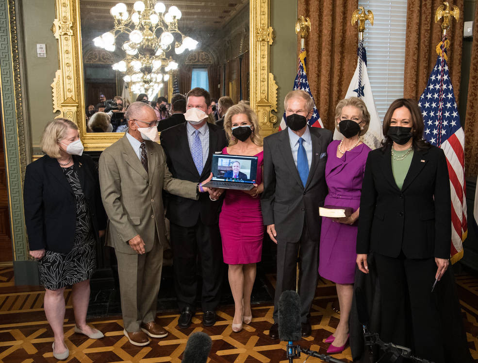 Bill Nelson Swearing In, May 3, 2021<br />From left to right, Pam Melroy, current nominee for NASA deputy administrator, former NASA Administrator Charles Bolden, Bill Nelson Jr., son of Bill Nelson, Nan Ellen Nelson, daughter of Nelson, former Senator Bill Nelson, his wife, Grace Nelson, and Vice President Kamala Harris pose for a photo after Nelson was ceremonially sworn in as the 14th NASA administrator, Monday, May 3, 2021, at the Ceremonial Office in the Old Executive Office Building in Washington. A Moon rock collected by astronaut John Young during the Apollo 16 mission was also on display.<br />Credits: NASA/Aubrey Gemignani